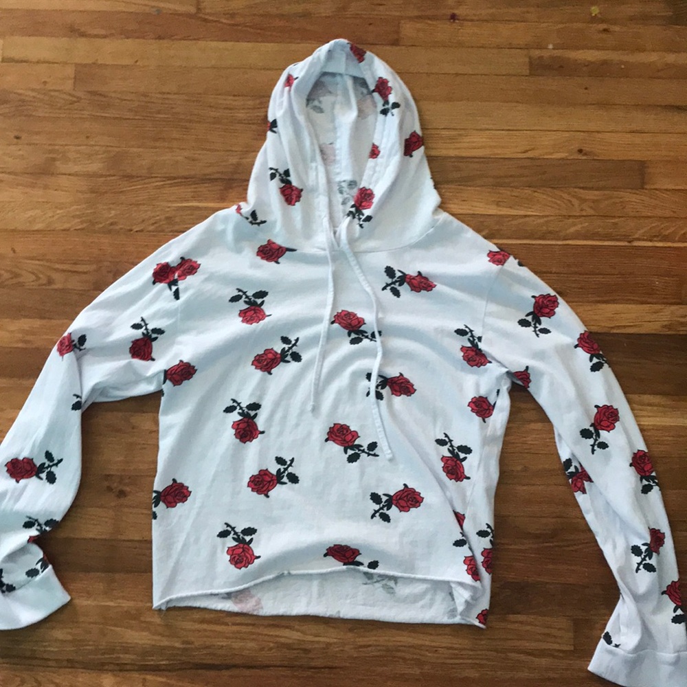 A loose sweater with roses on it only wore once